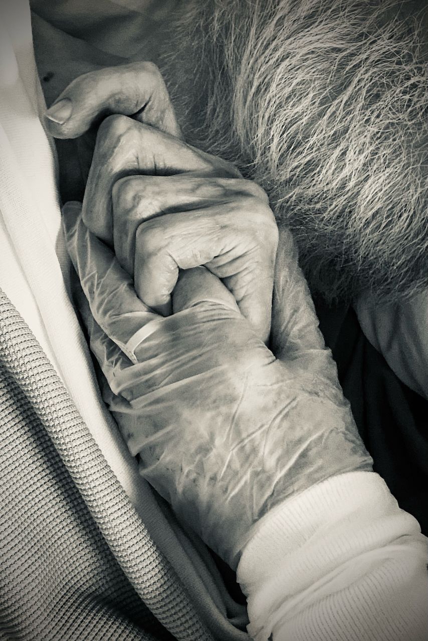 My sister's hand holding my father's hand